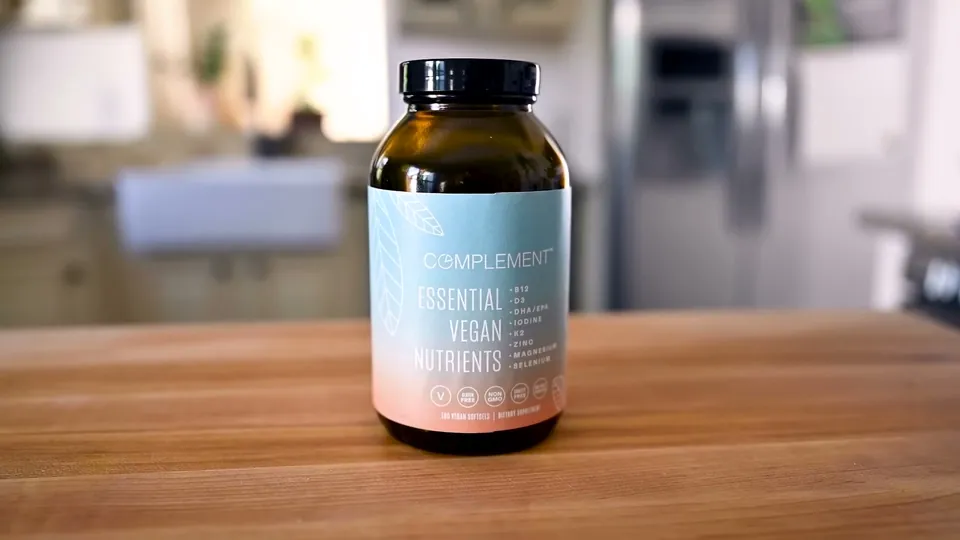 COMPLEMENT's vegan nutrients on the counter in Rainbow Plant Life's read, January 2022